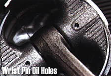 Wrist pin oil holes
